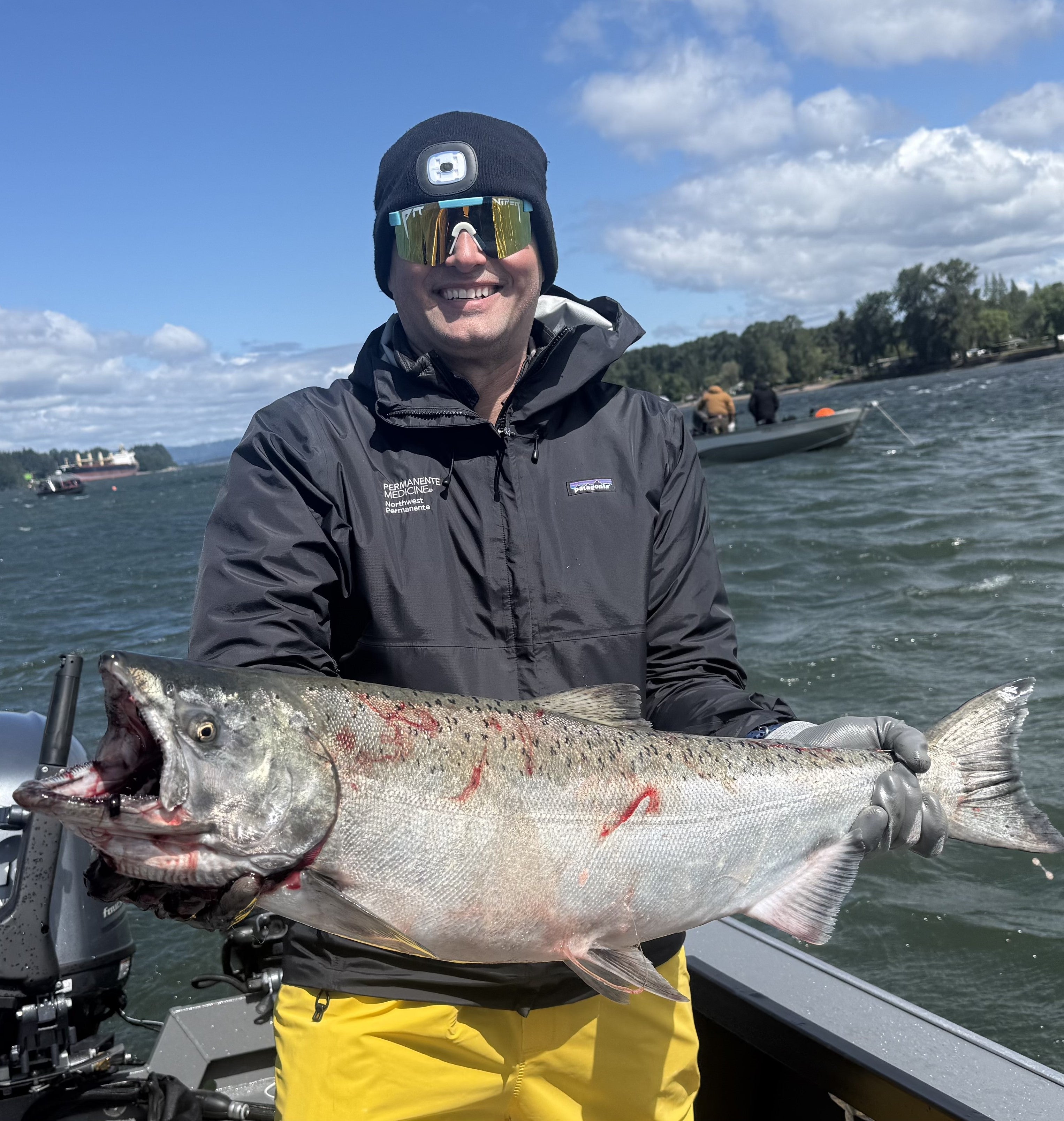 Justin Johnson with a bright spring chinook caught on the Tater Tot